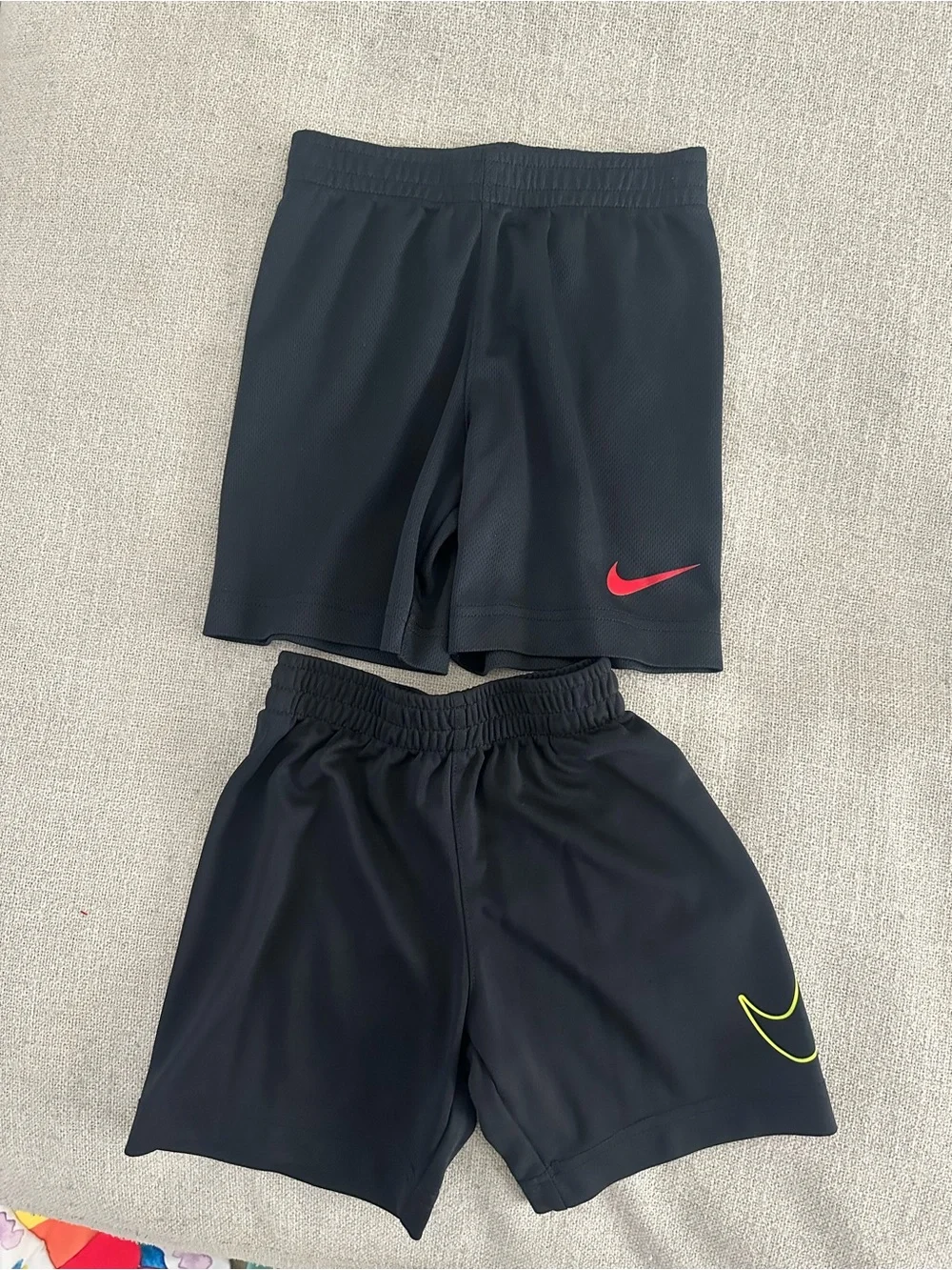 Nike Black Kids Athletic Shorts with Red and Neon Yellow Swooshes